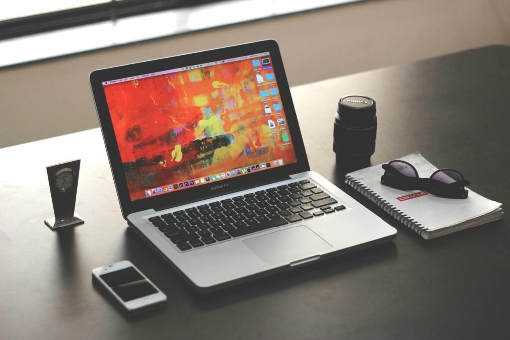 Tech blogger workspace with laptop and digital devices